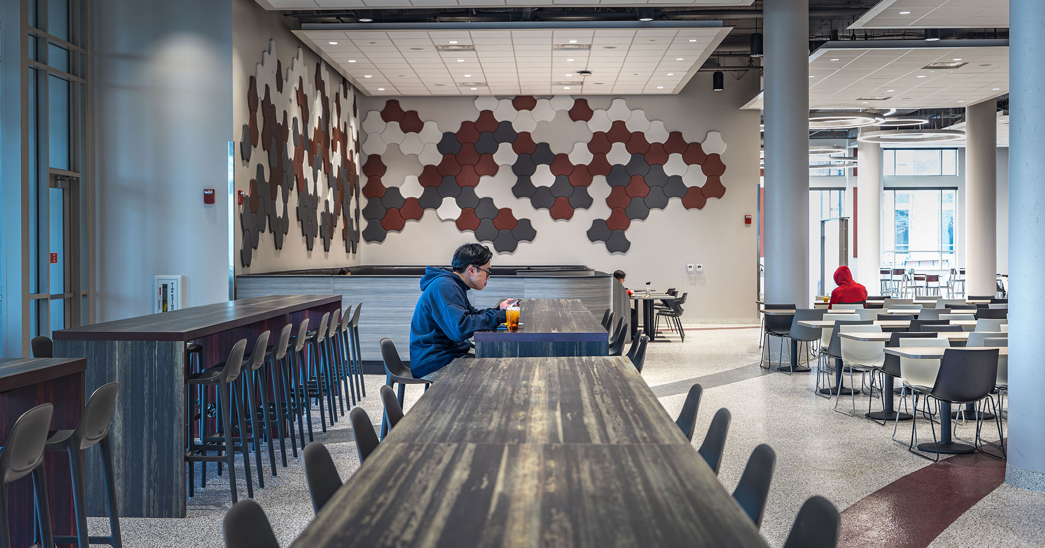 Student dines at USC Campus Village Dining Hall designed by Columbia architect BOUDREAUX